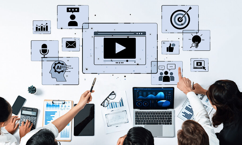 Digital marketing team reviewing video ad performance metrics on analytics dashboard during campaign strategy meeting